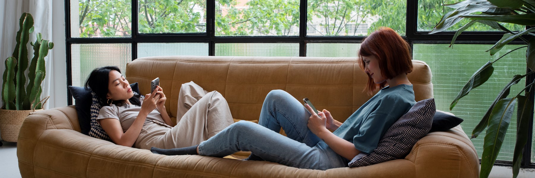 Full Shot Women Sitting Couch With Smartphone