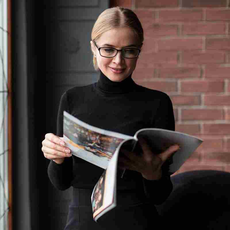 Beautiful Woman Reading Magazine